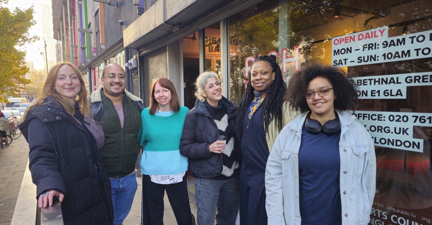 The upswing team. 6 people standing outside of Rich Mix in London who are diverse in age, ethnicity and gender